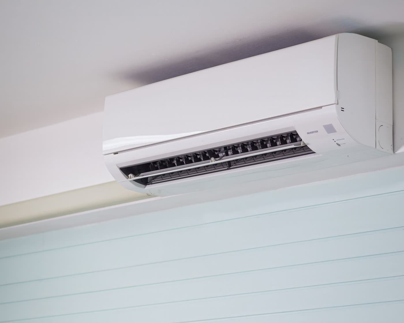 Wall-mounted split system air conditioner in a home
